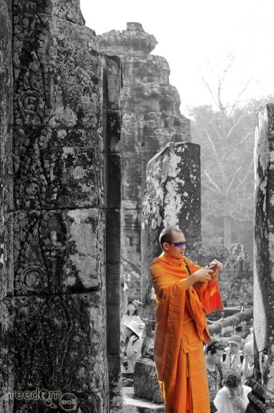 tourist monk at bayon temple
